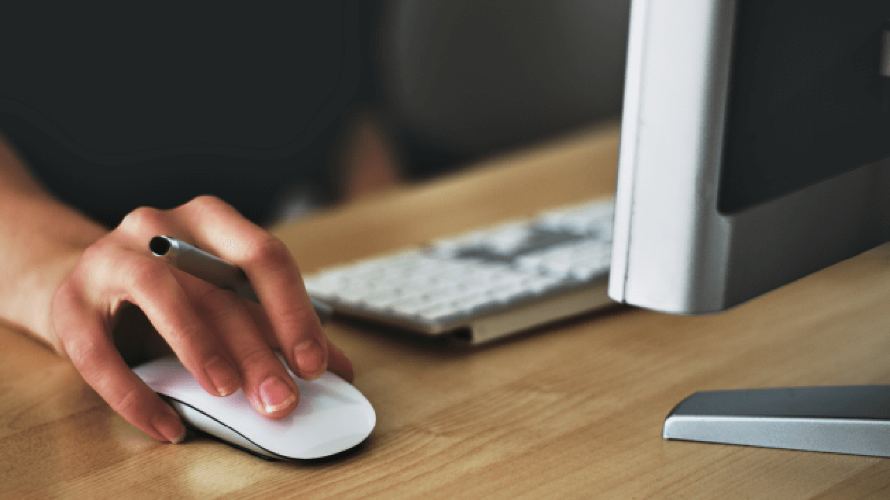 Close up of hand clicking a computer mouse