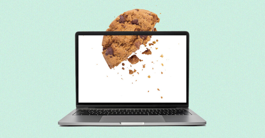 laptop with a crumbling cookie entering it