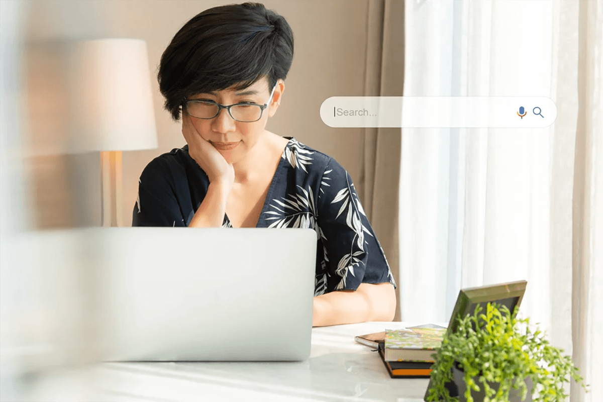Woman with laptop using search