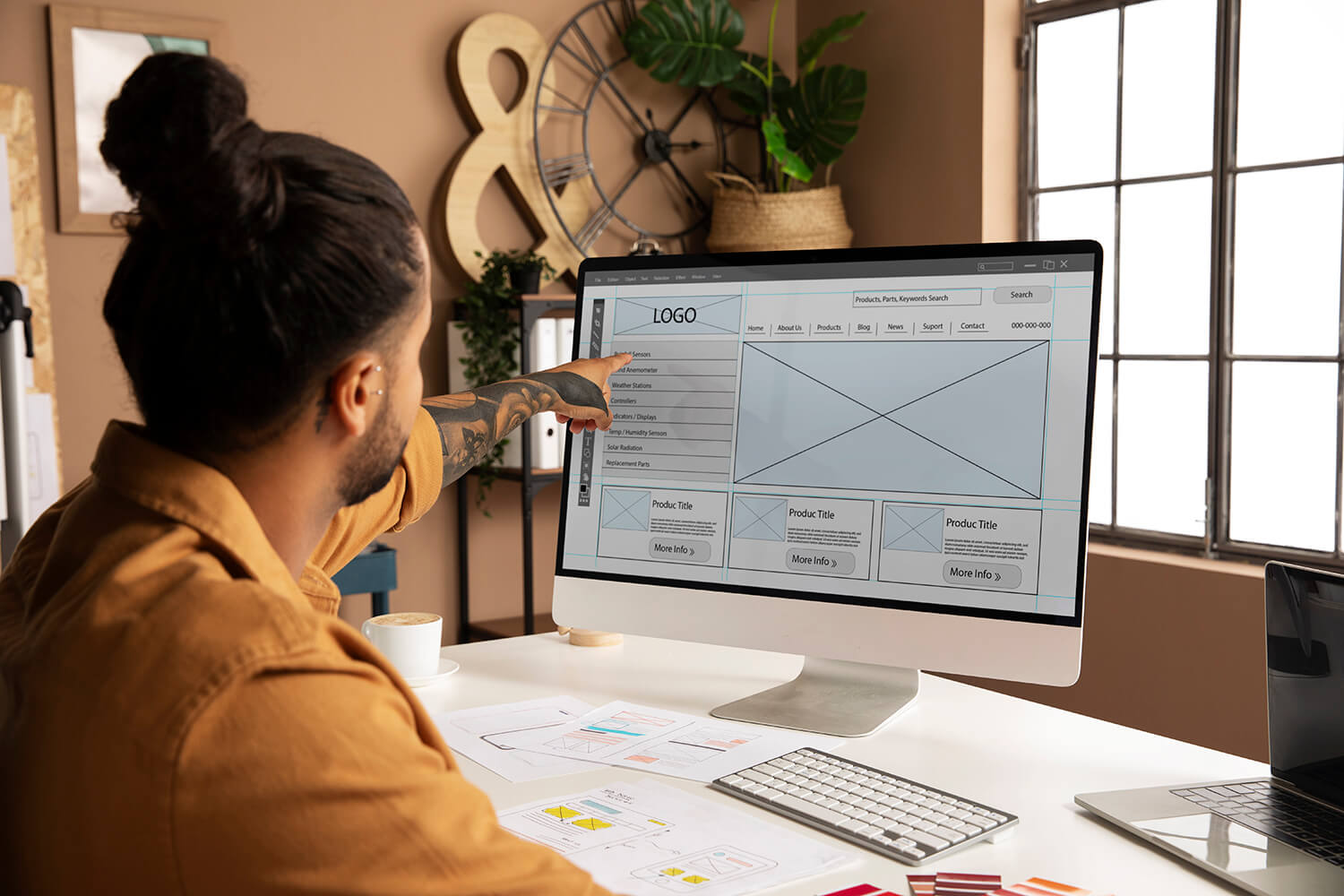 Man designing an e-commerce website in a desktop