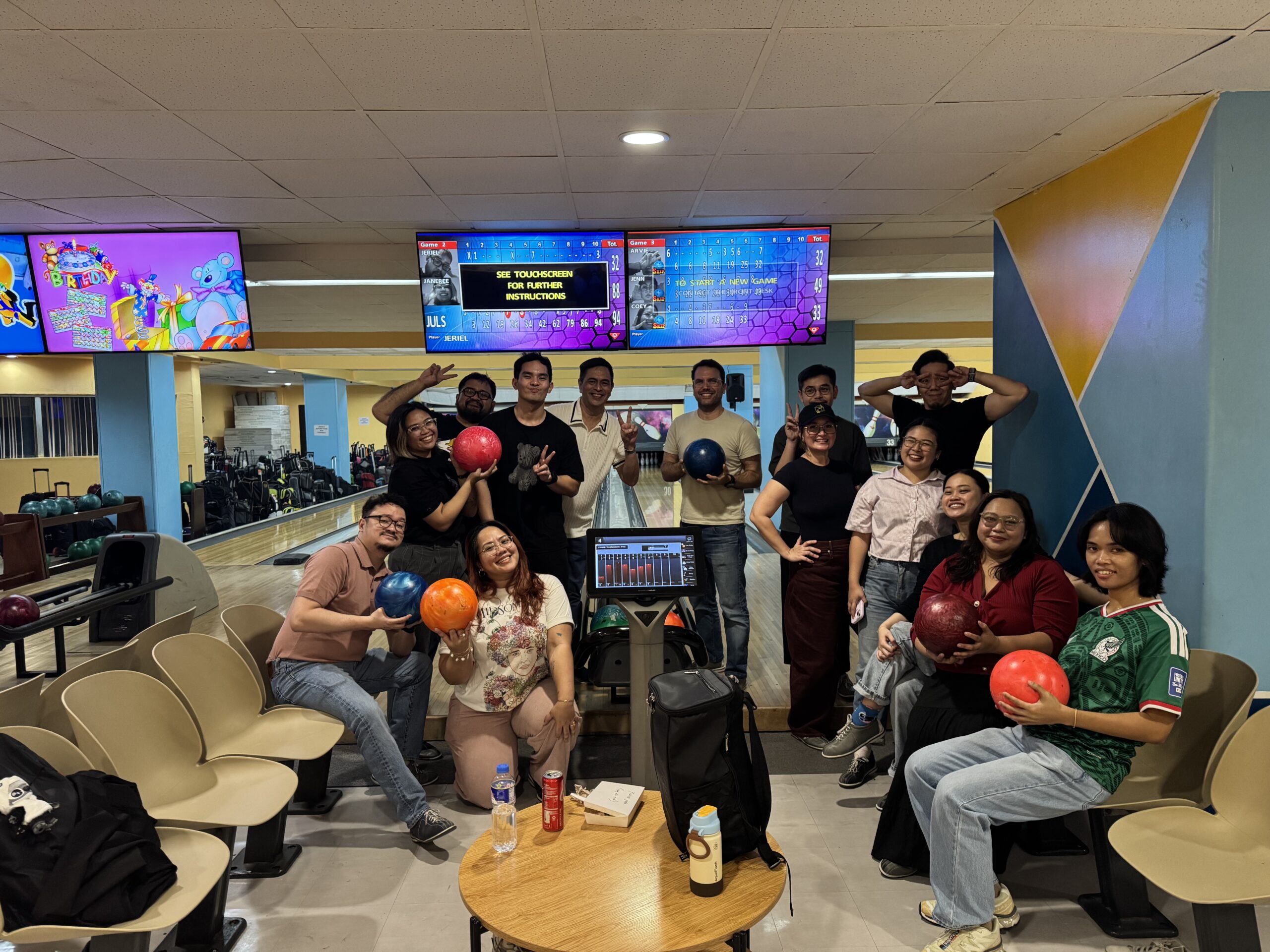Truelogic team posing for a picture in Puyat's bowling alley